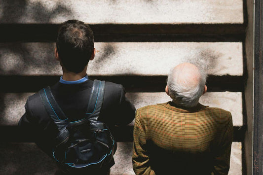 Two men standing on a staircase